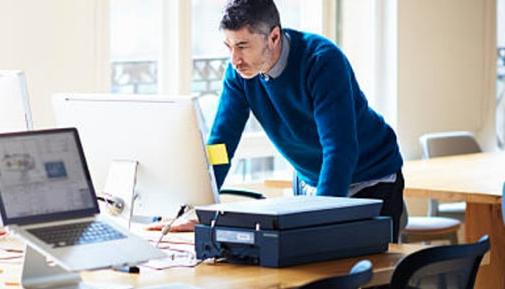 Business man standing at desk